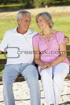 Happy Senior Couple Smiling Outside in Sunshine