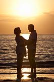 Senior Man & Woman Couple on Beach at Sunset