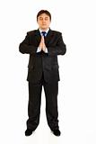  Full length portrait of praying businessman with closed eyes

