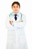 Authoritative medical doctor with crossed arms on chest
