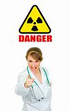  Concept-radiation hazard! Evil medical doctor woman shaking her finger
