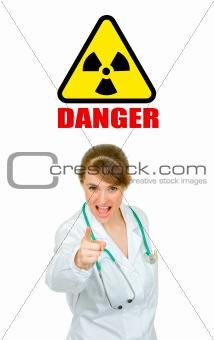  Concept-radiation hazard! Evil medical doctor woman shaking her finger
