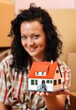 Woman with miniature house