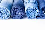 Rolls of Blue Jeans isolated on white background