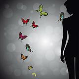 Woman silhouette with colorful butterfly
