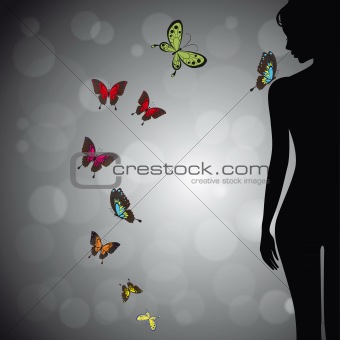 Woman silhouette with colorful butterfly