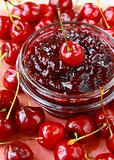cherry jam at bank and fresh ripe cherries