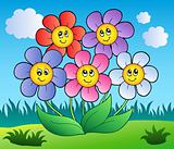 Five cartoon flowers on meadow