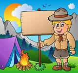 Scout boy holding board outdoor