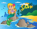 Seascape with cartoon mermaid