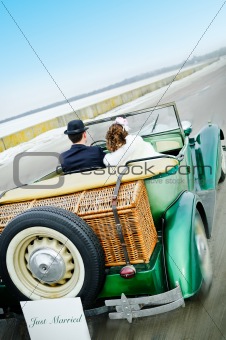 Newlyweds In Wedding Car
