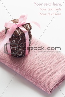 Delicious chocolate chip cookies with icing on a pink napkin