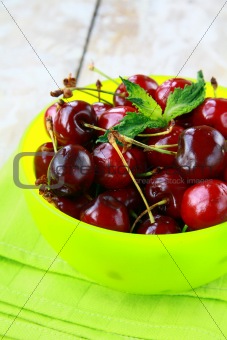 fresh organic ripe black cherry with mint leaf