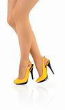 Beautiful ladies legs in yellow high heels