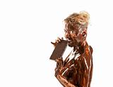 naked blond girl eating chocolate