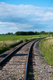 Railroad Tracks Curving Off into the Distance