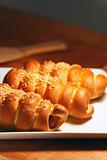 fresh baked pastry with sausage and sesame