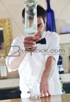 pro barman prepares coctail drink