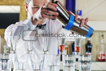 pro barman prepares coctail drink 