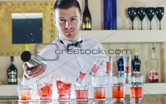 pro barman prepares cocktail 