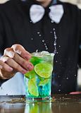 pro barman prepares cocktail drink 