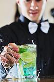 pro barman prepares cocktail drink