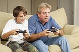 Man and Boy Play Video Games