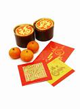 Chinese New Year rice cakes, oranges and red packets