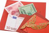 Chinese New Year red packets and currency notes