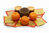 Chinese New Year rice cakes, oranges and red packets 