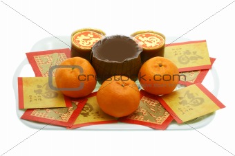 Chinese New Year rice cakes, oranges and red packets 