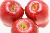 Three fresh red apples