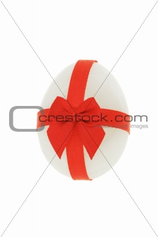 Easter egg decorated with red bow ribbon