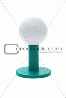 Golf ball on green rubber tee 