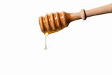 honey drops from a honey dipper