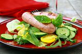 Lunch salad with grilled sausage and fresh vegetables