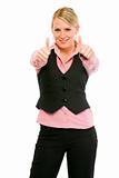 Smiling modern business woman showing thumbs up gesture
