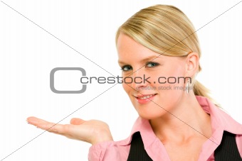 Smiling modern business woman presenting something on empty hand
