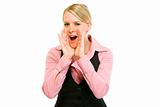 Cheerful modern business woman shouting through megaphone shaped hands
