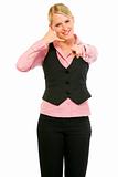 Smiling modern business woman showing contact me gesture
