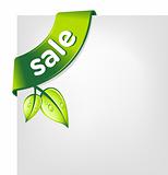 Vector Green SALE ribbon with leaves on the blank paper
