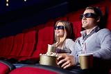 Young couple in 3D cinema