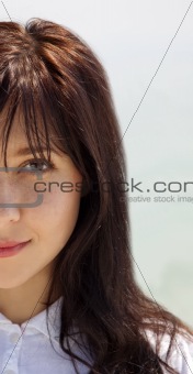 Half face portrait of  brunette girl.