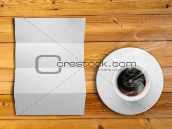 White fold paper and a white coffee cup