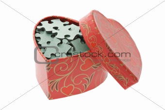 Jigsaw puzzles in heart shape gift box
