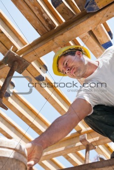 Construction worker under formwork girders
