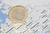 one euro coin on the map of Europe