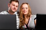 couple with laptops
