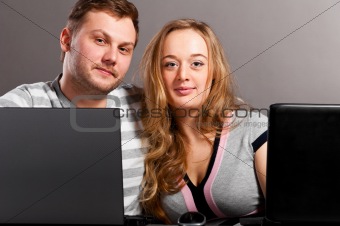 couple with laptops