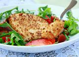 salad with fried cheese, arugula and fresh vegetables